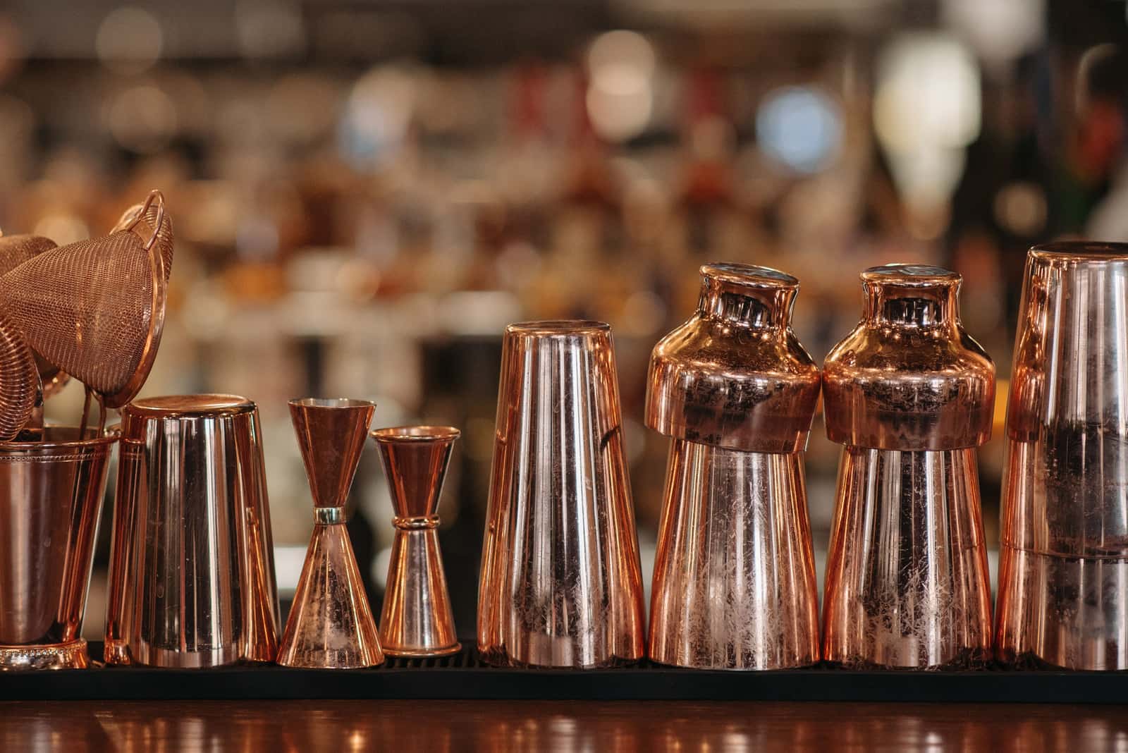 A stainless steel cocktail shaker on a bright kitchen counter