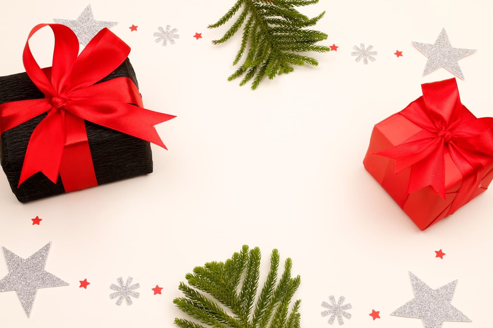 Christmas gift wrapping with pine on a bright table