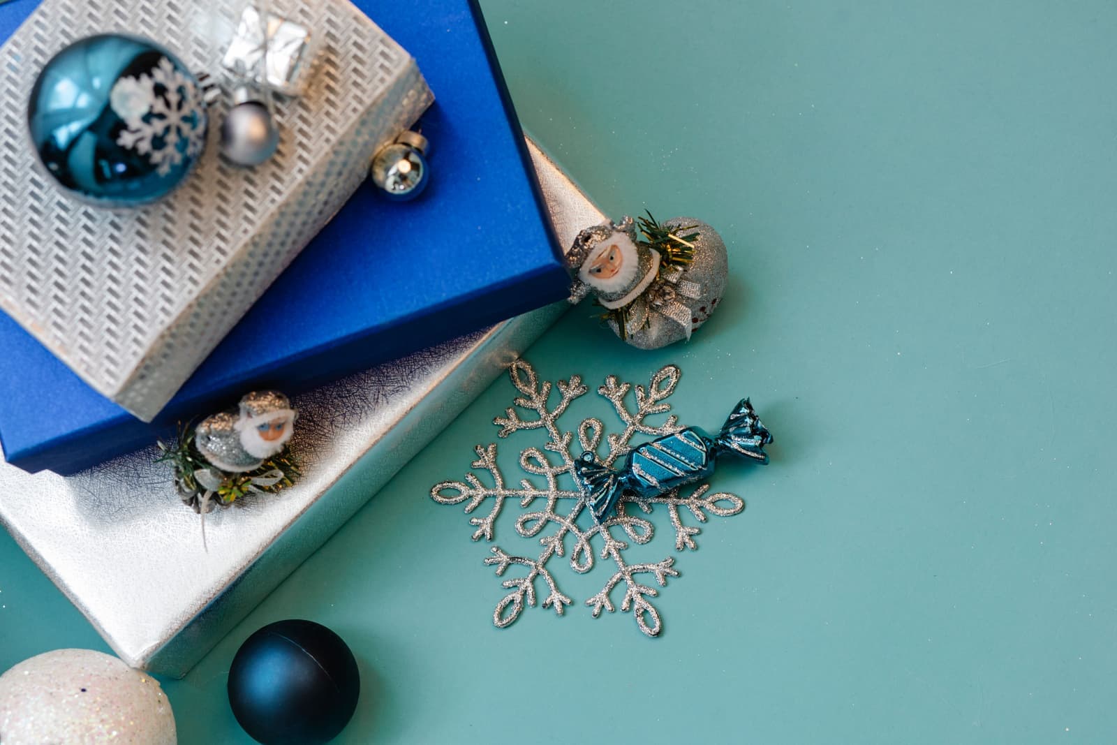 Small wrapped gifts laid out flat on a bright surface