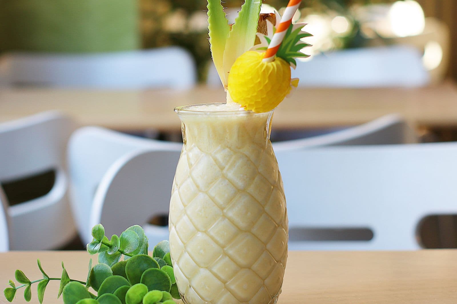 A tropical cocktail served in a textured pineapple glass