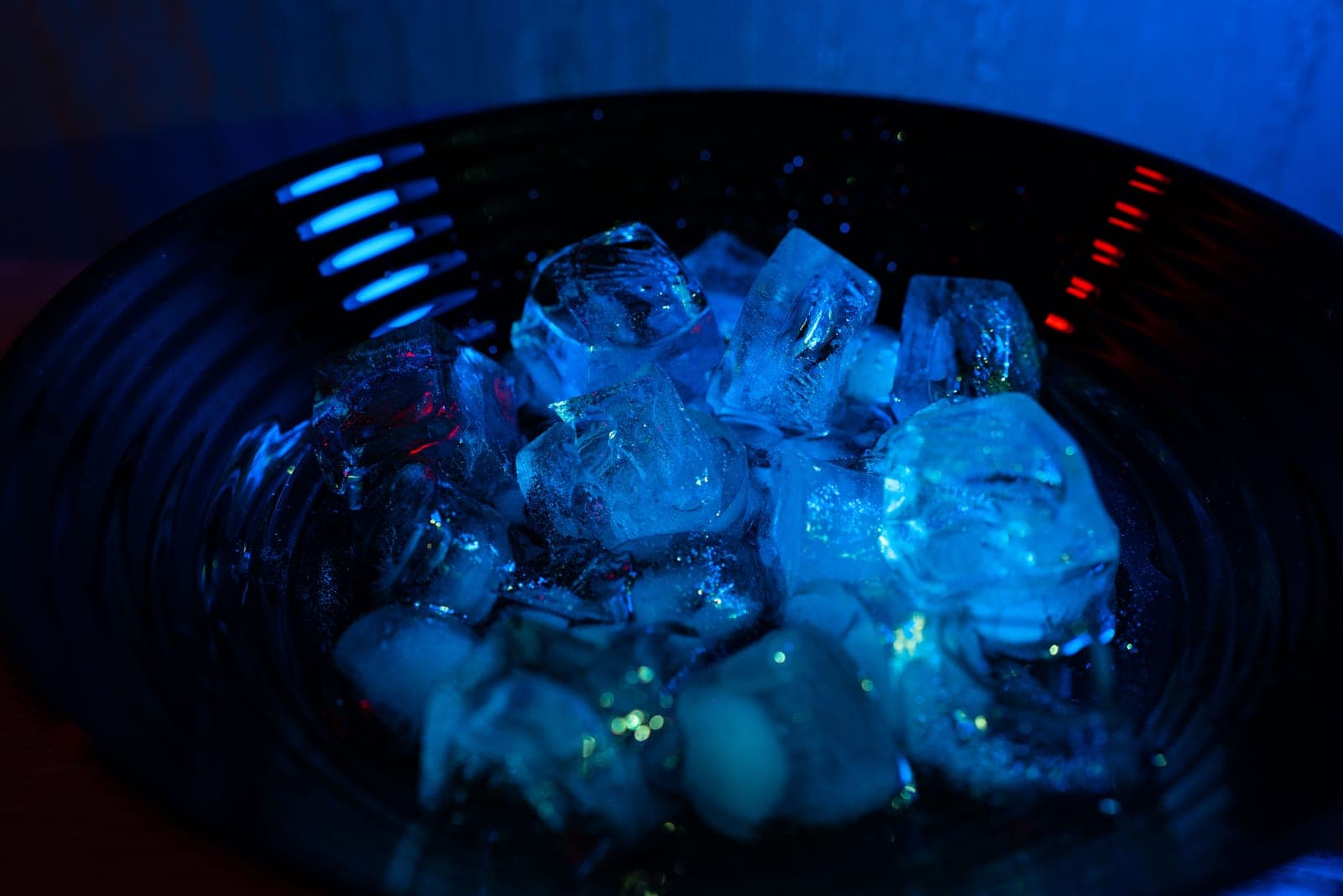 Ice cubes in a bowl in a bright kitchen in daylight