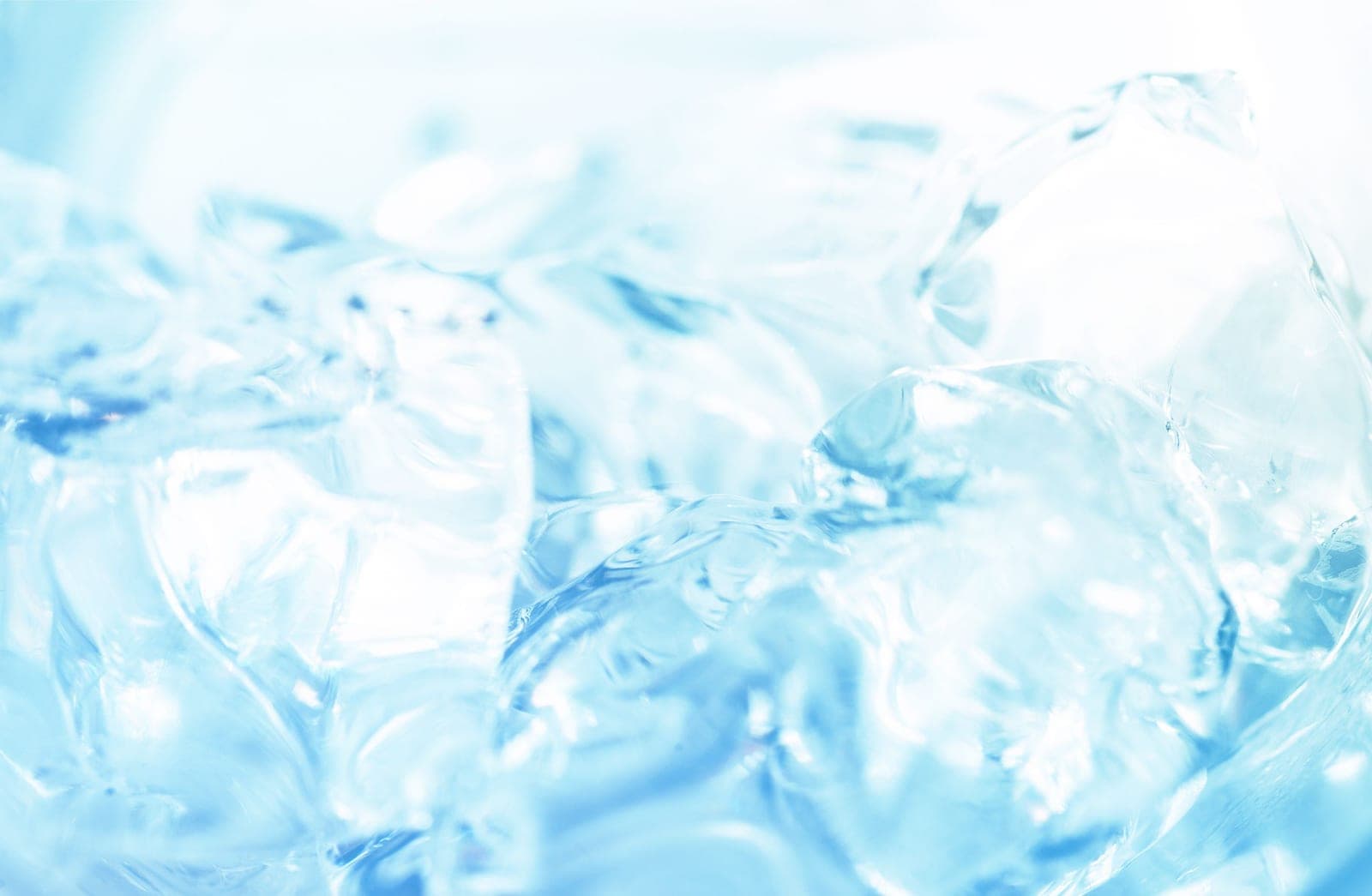 A drink with ice melting in bright light